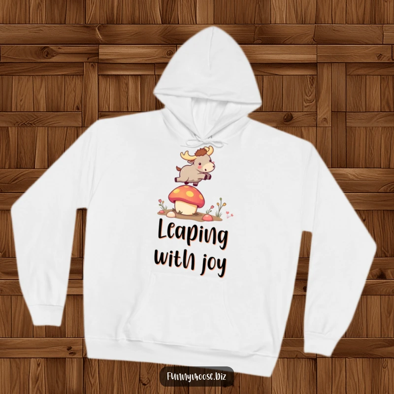 Funny kawaii moose in a cozy hoodie, launching from a vibrant bouncy mushroom, a humorous and comfortable gift item.