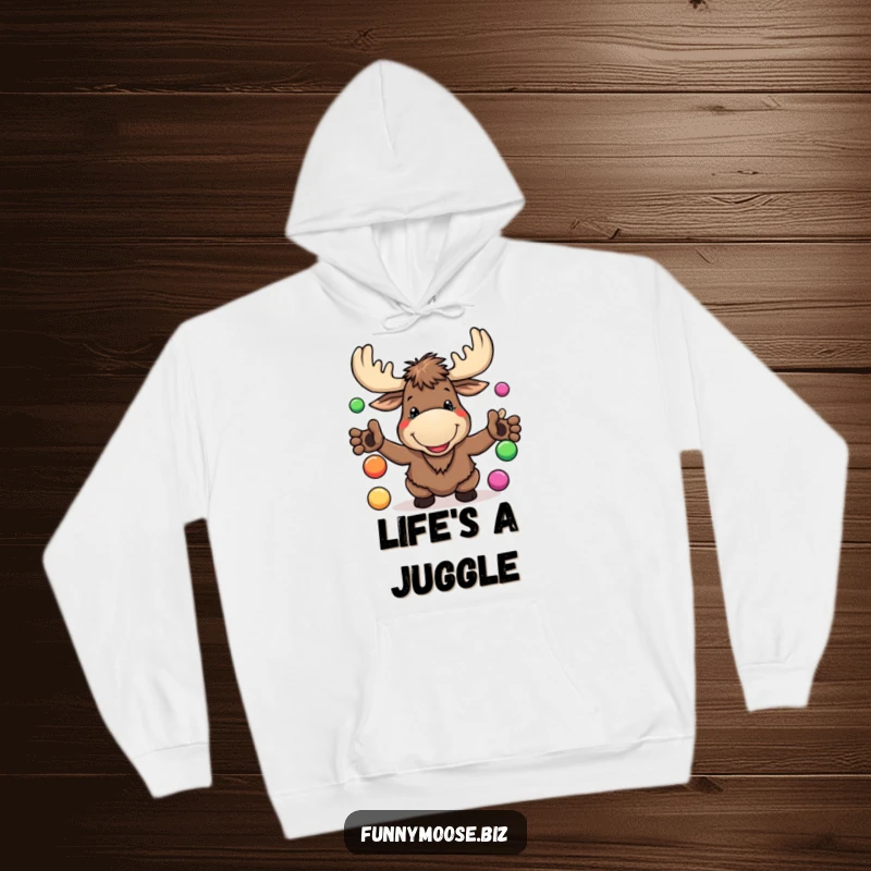 Funny Kawaii Moose Hoodie with a goofy grin, juggling balls, offering cozy comfort and delightful woodland humor.